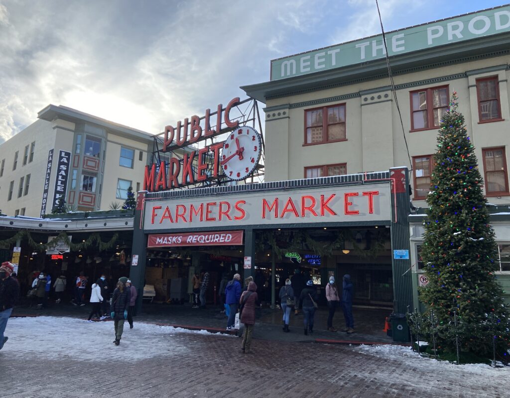 Visitors walking into Pike Place Market